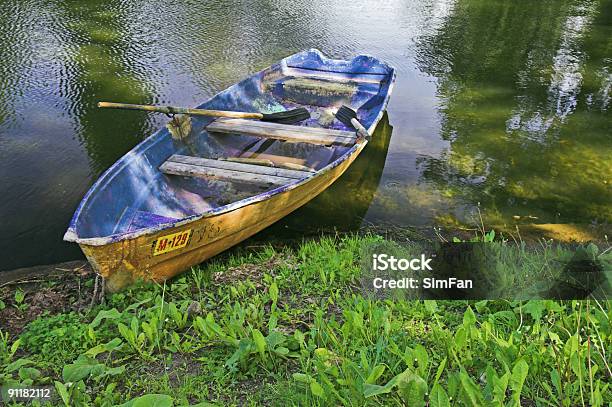 Boat At Pond Bank Stock Photo - Download Image Now - Pond, Blue, Bush