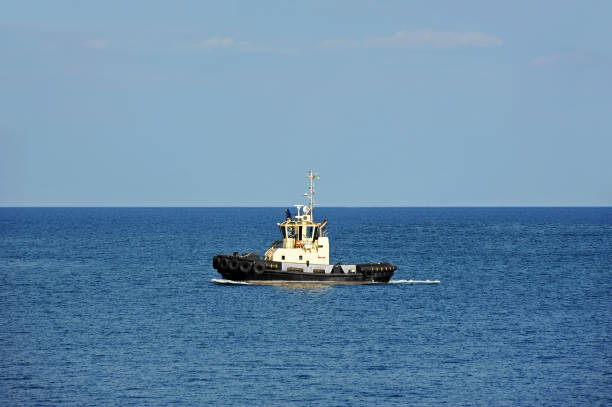 istock Tugboat in harbor quayside 911828402