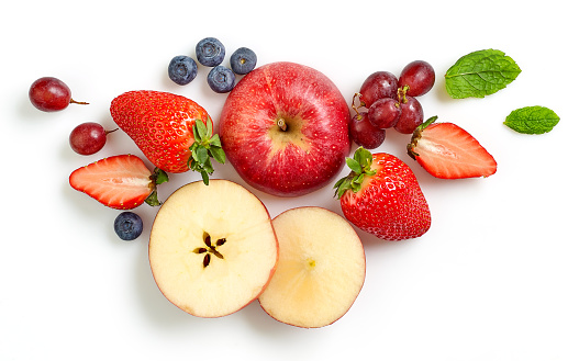composition of various fresh fruits and berries isolated on white background, top view