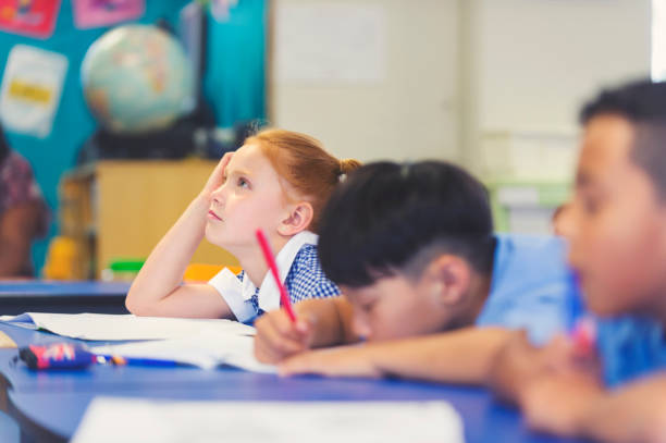 school children bored and tired in class. - learning boredom studying child imagens e fotografias de stock