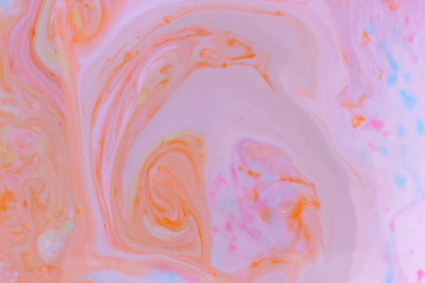 istock Abstract multicolored background with orange dyes on liquid, orange stains on milk, cosmic holographic pattern, minimalism, pop art texture for designer, art 911843586