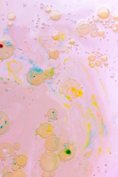istock Abstract multicolored background on a liquid with oil, multicolored oil drops on a pink background, cosmic holographic pattern, minimalism, pop art texture for a designer, art 911846714