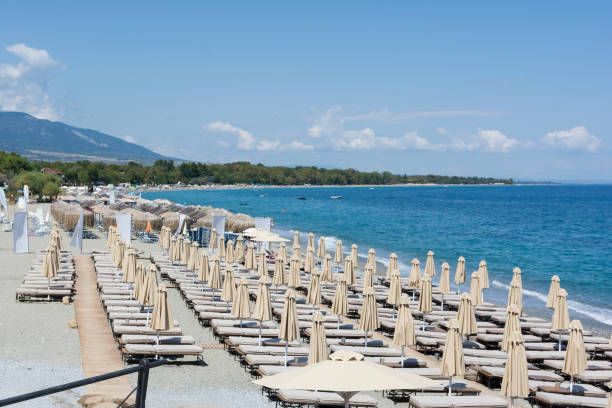 istock Beach umbrella and sunbeds at Mediterranean sea 911846914