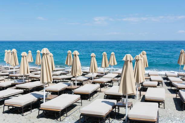 istock Beach umbrella and sunbeds at Mediterranean sea 911849050