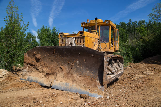 istock Big industrial yellow bulldozer leveling ground on road construction 911849082
