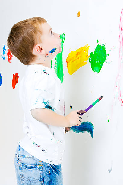 istock Child painting a wall 91185181