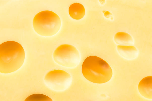 istock Texture of the cheese. Pattern of cheese with large holes 911852226