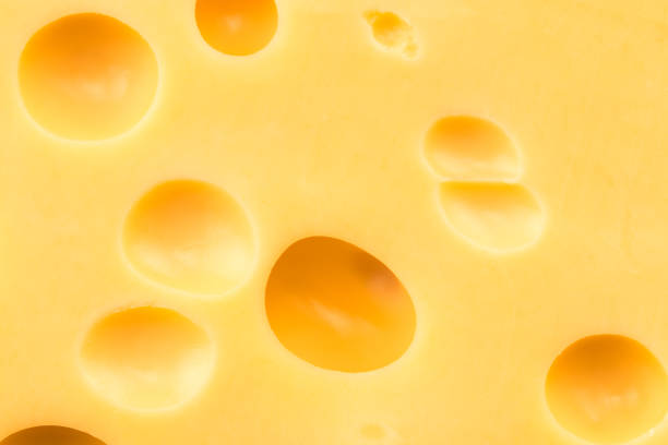 istock Texture of the cheese. Pattern of cheese with large holes 911852234