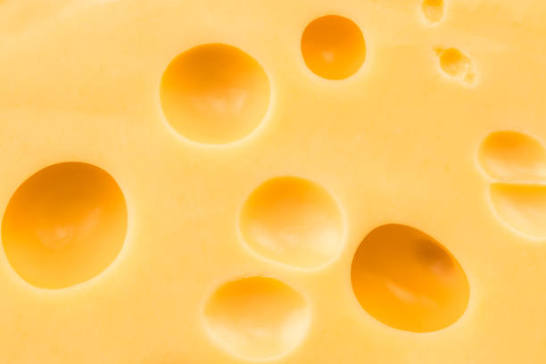 istock Texture of the cheese. Pattern of cheese with large holes 911852252