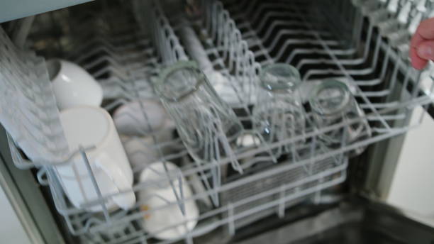 istock Clean Glasses and Cups in a Dishwasher 911855042