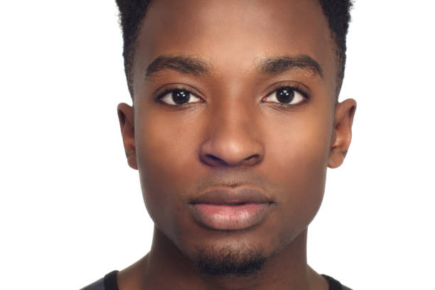 istock young african man portrait close-up studio white background face 911861872