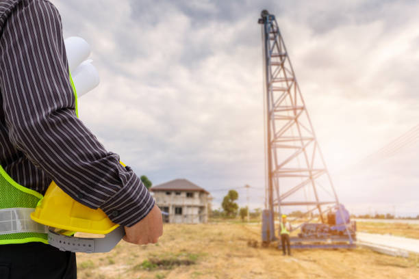 istock Asian business man construction engineer worker at house building site 911863966
