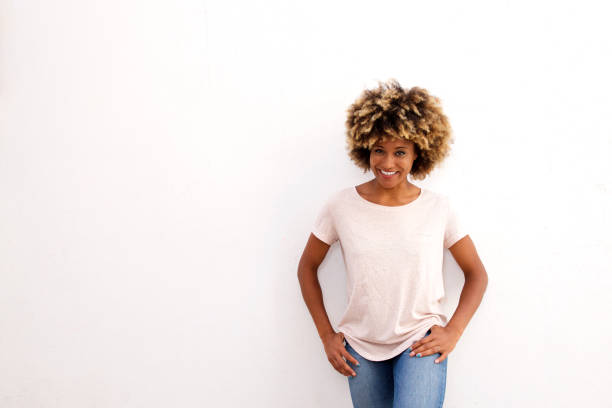 istock attractive black woman standing against white background 911864756