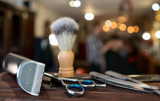 Close-up on a set of shaving tools at a barber shop - grooming kit concepts