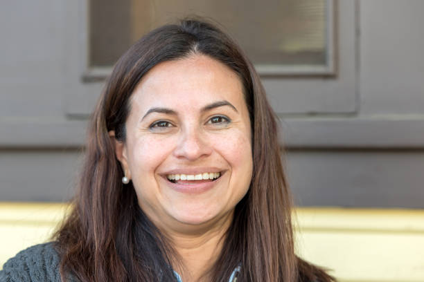 istock Smiling Mature Hispanic Woman 911875500
