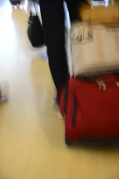 istock Suitcase in Motion at Airport 911882312