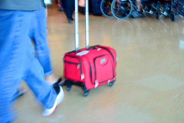 istock Suitcase in Motion at Airport 911882320