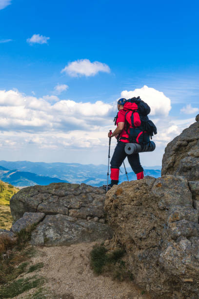istock Man hiking in mountains 911882764