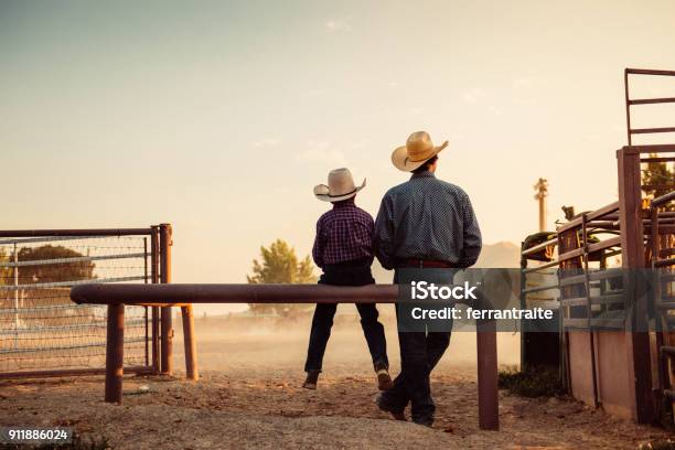 Father And Son At Rodeo Arena Stock Photo - Download Image Now - Cowboy, Rodeo, Family