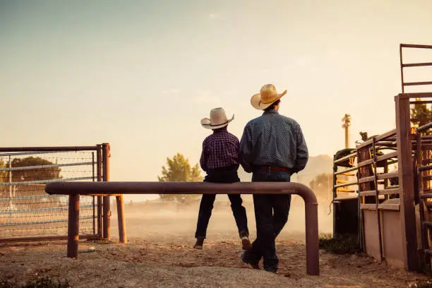 Photo of Father and son at rodeo arena