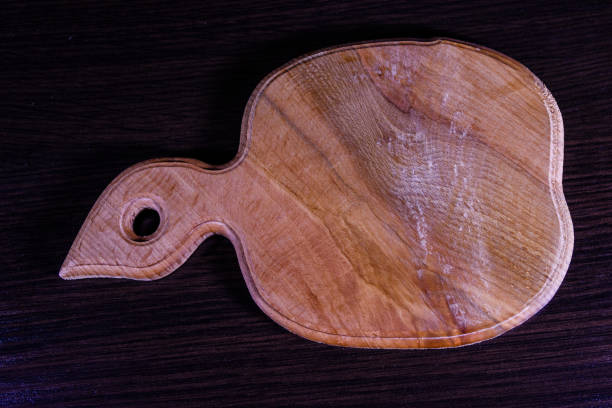istock Cutting board on the dark wooden table. Top view 911892048