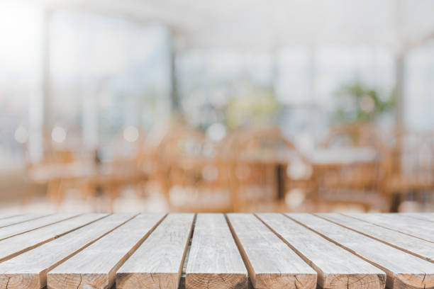 Wood table top and blurred restaurant interior background