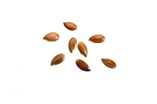 istock Close up of flax seeds isolated on white background 911918192