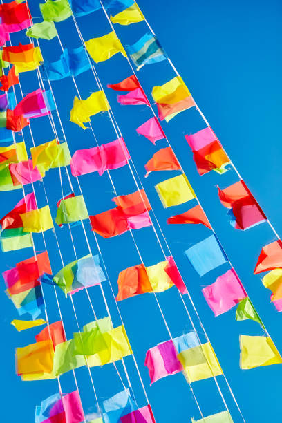 istock Colorful flags against the blue sky 911922028