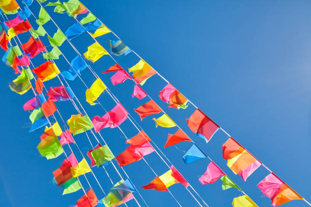 istock Colorful flags against the blue sky 911922262