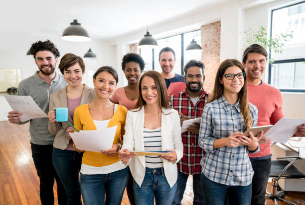 istock Group of business people working together at a creative office 911928638