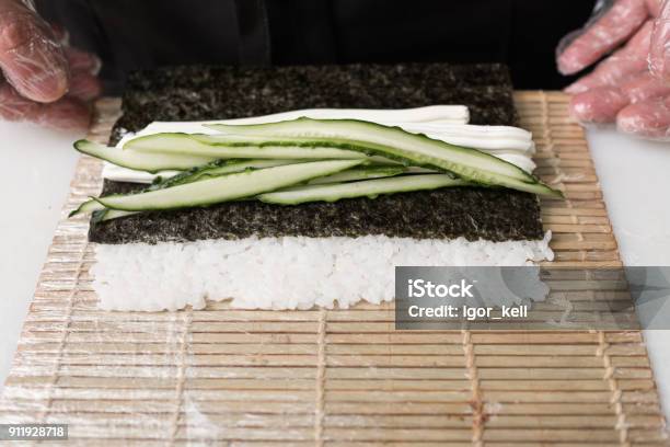 Chef Prepare Sushi Roll Fresh Cucumber Ingredients Stock Photo - Download Image Now - Chef, Copy Space, Cucumber