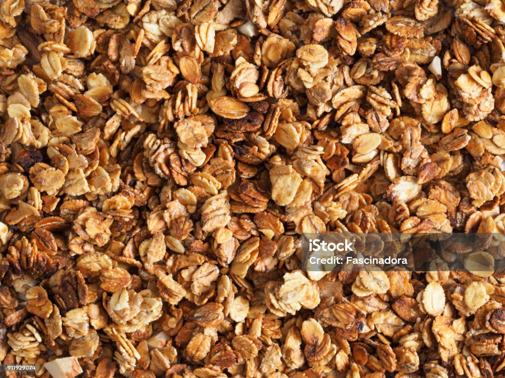 homemade granola texture Organic homemade Granola Cereal with oats and almond. Texture oatmeal granola or muesli as background. Top view or flat-lay. Copy space for text. Granola Stock Photo