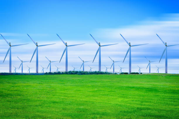 Wind turbines generating electricity on green meadow at daytime. Wind turbines generating electricity on green meadow at daytime. landscape alternative energy scenics farm stock pictures, royalty-free photos & images