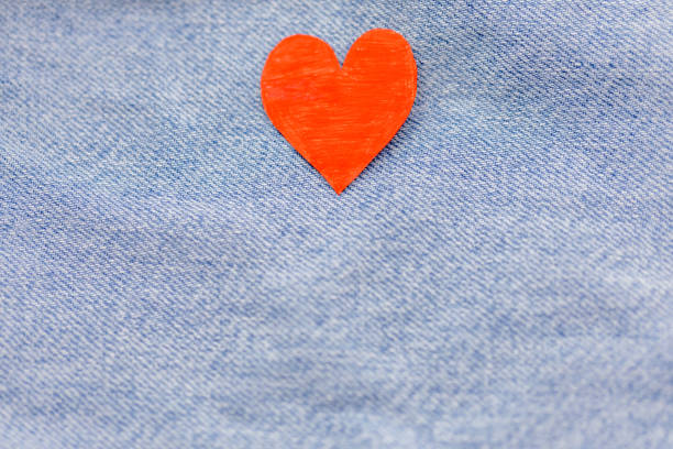 istock Paper red heart with Denim jeans texture background. Valentine Concept 911936892