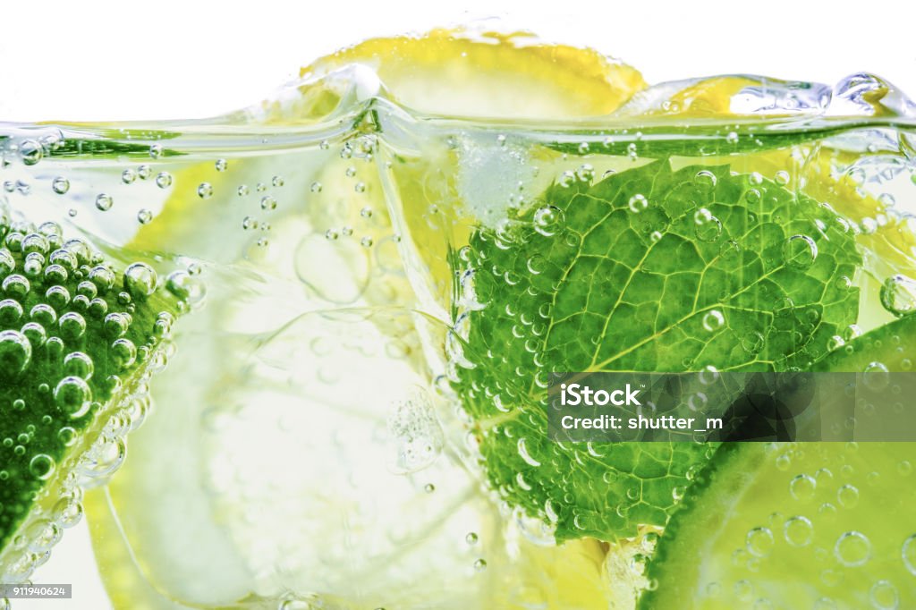 Lemon drop in fizzy sparkling water, juice refreshment Carbonated Stock Photo