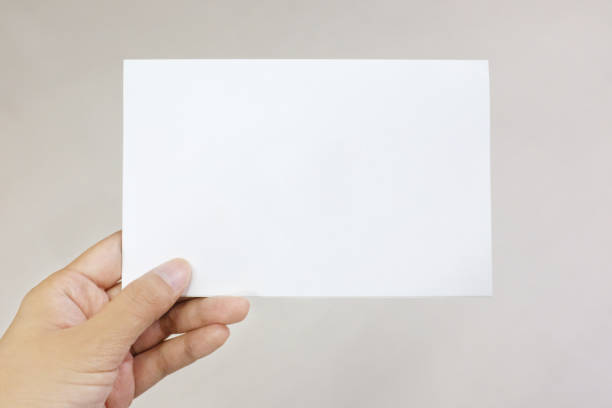 istock A hand holding a paper card 911941378
