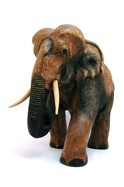 istock African wooden elephant isolated on white. 91195058