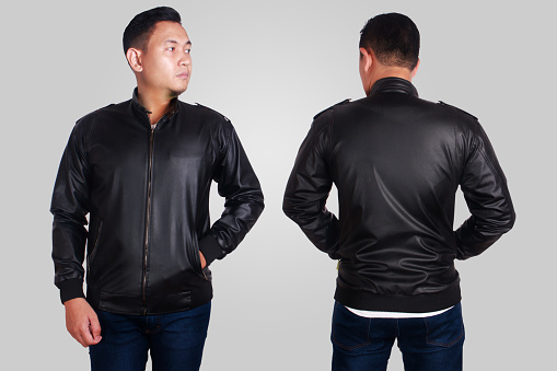 Blank leather jacket mock up, front, and back view, isolated on grey. Asian male model wear plain black long sleeved leather jacket mockup. Clothes design presentation for print