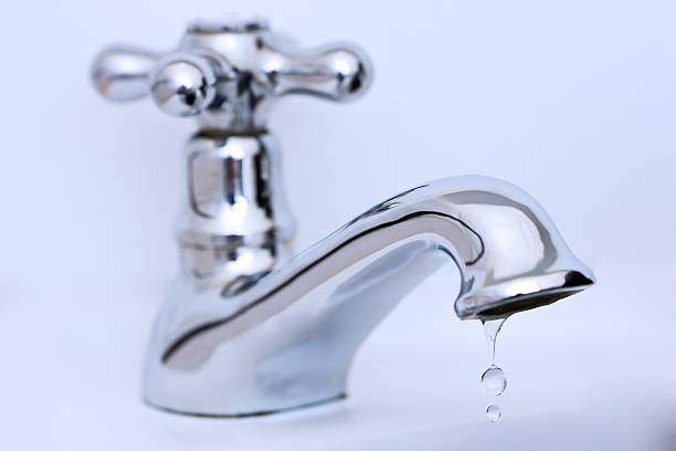 istock Dripping silver tap in a washroom 91196242
