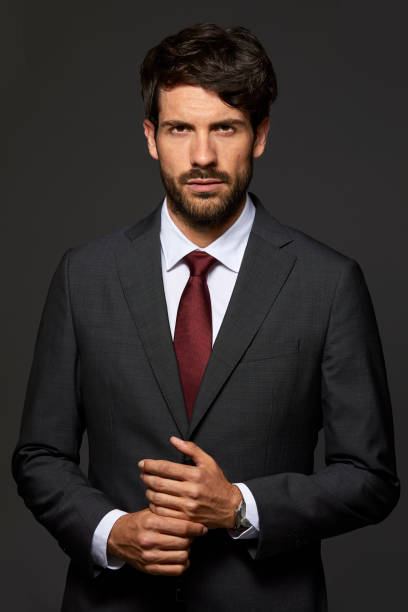 istock Portrait of serious executive with hands clasped 911963658