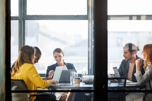 istock Business people discussing seen through glass 911963908