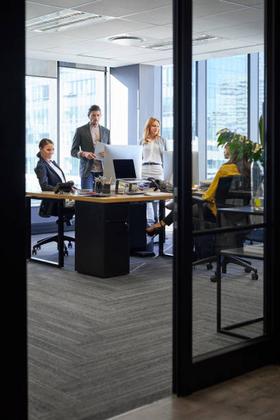 istock Business coworkers at office during presentation 911964170