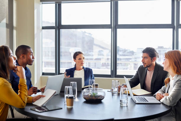 istock Female entrepreneur discussing with colleagues 911964190