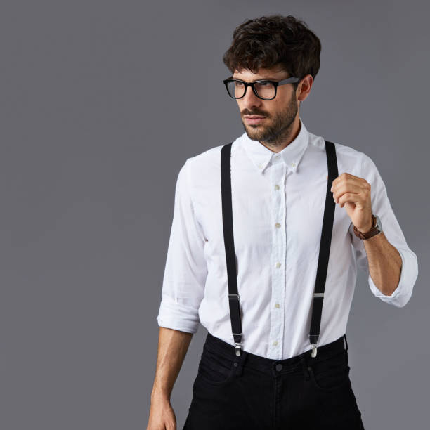 istock Thoughtful businessman against gray background 911964228