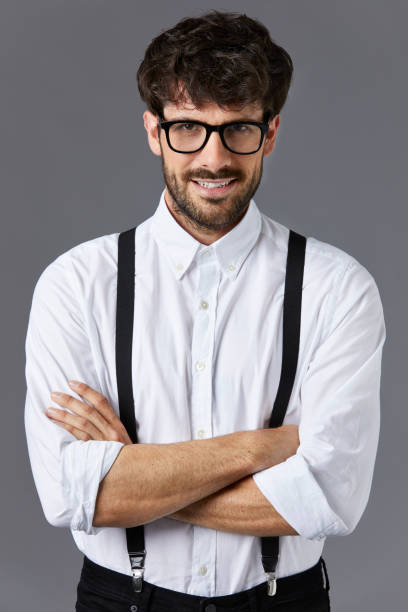 istock Smiling businessman standing with arms crossed 911964230