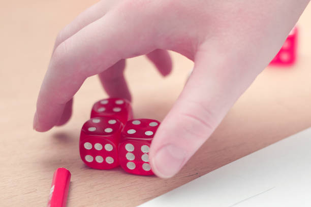 istock Playing board games, dices in child hand 911964468