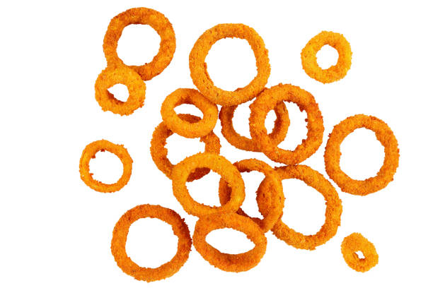 fried onion rings isolated on white golden breaded fried onion rings isolated on white background, view from above fried onion rings stock pictures, royalty-free photos & images