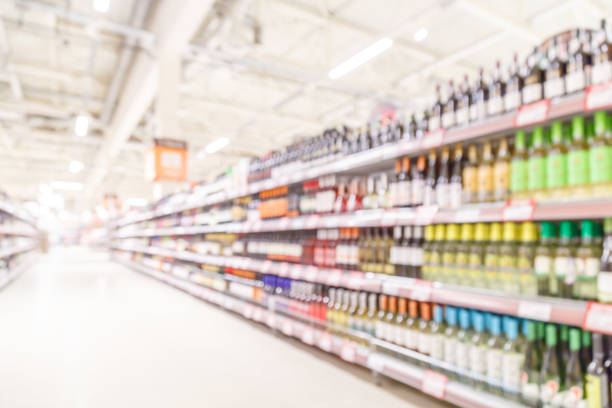 Alcohol bottles kept in a shelf in bar