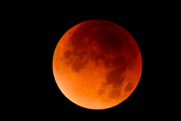 istock Blood moon - full Lunar Eclipse in the night sky 911971106