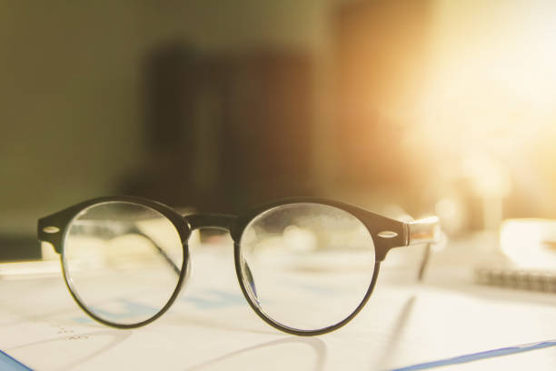 istock vintage glasses,on table in Studying examining. Tutor books with friends. Young students campus helps friend catching up and learning. People, learning, education 911971184